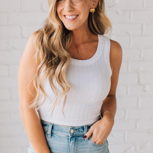 Blonde girl modeling a solid ribbed cropped tank