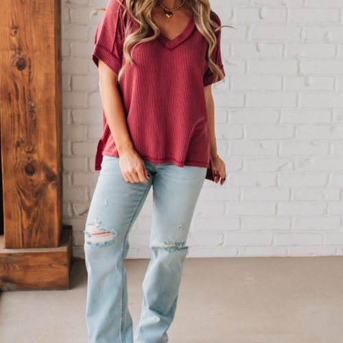 women modeling a burgundy short sleeve corded v neck top