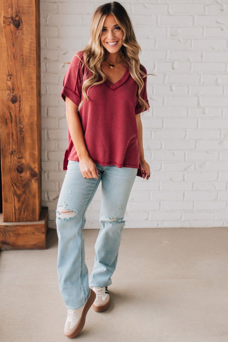 women modeling a burgundy short sleeve corded v neck top