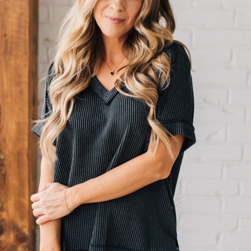 women modeling a black short sleeve corded v neck top 